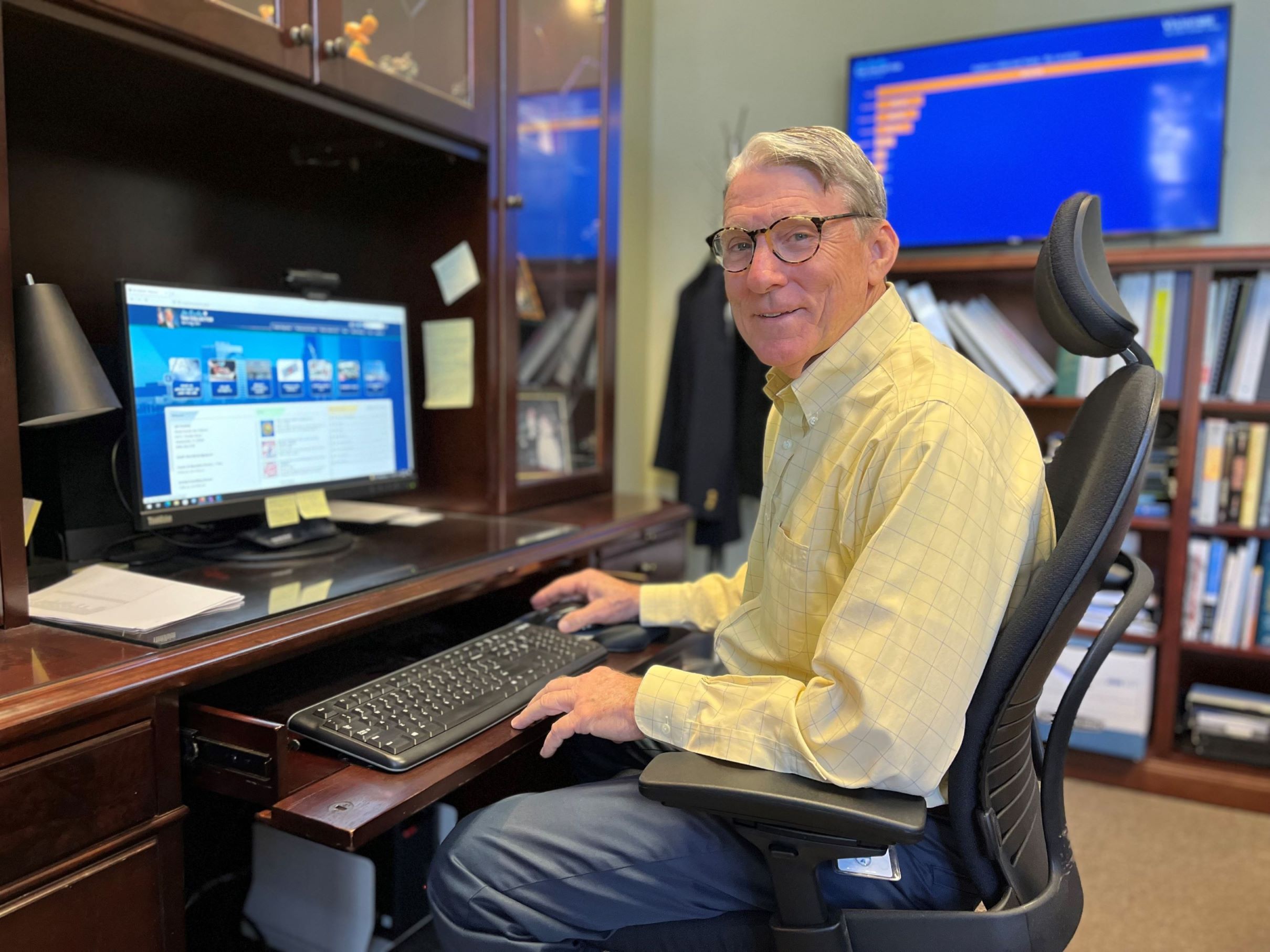 Jim Overton at desk